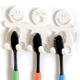 Praktyczny biały organizer na szczoteczki do zębów uchwyt łazienkowy z przyssawką plastikowy wieszak zabawny kształt